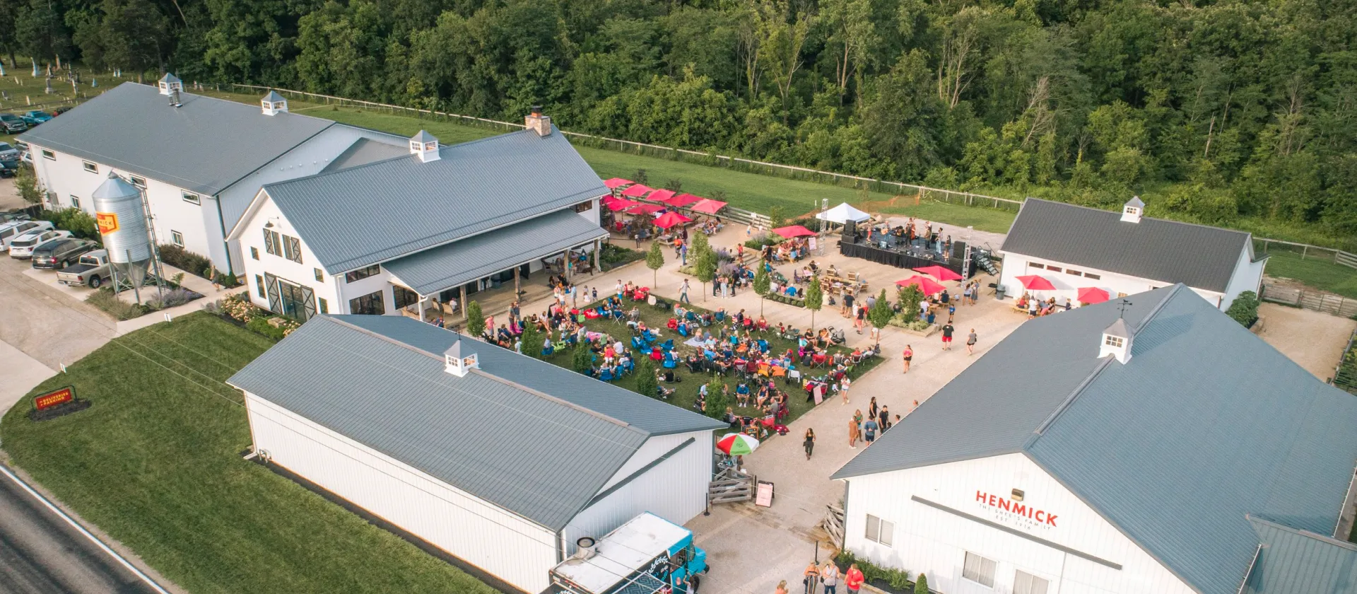 An aerial photo of a gathering of people at an outdoor eatery.